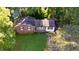 Ranch-style home on a grassy lot with mature trees at 1 Westbury Pl, Durham, NC 27707