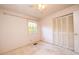 Bedroom with ceiling fan and bi-fold closet doors at 1 Westbury Pl, Durham, NC 27707
