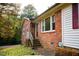 Brick ranch house with steps leading to the front entrance at 1 Westbury Pl, Durham, NC 27707