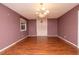 Bright dining room featuring hardwood floors and a chandelier at 1 Westbury Pl, Durham, NC 27707