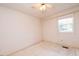 Bedroom with window, ceiling fan, and neutral walls at 1 Westbury Pl, Durham, NC 27707