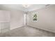 Bright bedroom with new carpet and large window at 2512 Scouting Trl, Raleigh, NC 27615