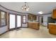 Kitchen with light wood cabinets, stainless steel appliances, and access to a dining area at 2980 Tram Rd, Fuquay Varina, NC 27526