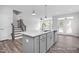 Modern kitchen island with white countertop and gray cabinets at 42 Blanton Ct, Lillington, NC 27546