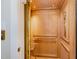 Modern wood-paneled elevator with brass accents adding luxury at 117 S Bloodworth St, Raleigh, NC 27601