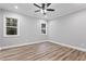 Empty bedroom with wood-look flooring, white trim, and a ceiling fan at 1431 Alabama Ave, Sanford, NC 27332