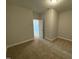 Spacious bedroom with carpet flooring and access to a shared bathroom at 441 Edison Rail Ln, Knightdale, NC 27545