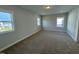 Upstairs bedroom with carpet and multiple windows at 441 Edison Rail Ln, Knightdale, NC 27545