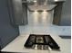 Stainless steel gas cooktop with modern controls at 441 Edison Rail Ln, Knightdale, NC 27545