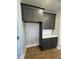 Modern kitchen with dark gray cabinets and quartz countertops at 441 Edison Rail Ln, Knightdale, NC 27545