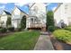 Two-story house with wooden deck and well-maintained lawn at 7732 Acc Blvd, Raleigh, NC 27617