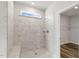 Large walk-in shower with marble tile and built-in seat at 88 Bering Cir, Angier, NC 27501