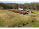 Aerial view of farm with various outbuildings at 739 Silk Hope Lindley Mill Rd, Siler City, NC 27344