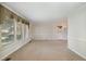 Spacious living room with large windows and neutral carpeting at 739 Silk Hope Lindley Mill Rd, Siler City, NC 27344