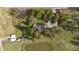 Aerial view of house, pond, and surrounding land at 739 Silk Hope Lindley Mill Rd, Siler City, NC 27344