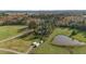 Aerial view showcasing home, pond, and acreage at 739 Silk Hope Lindley Mill Rd, Siler City, NC 27344