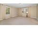 Bright bedroom with neutral carpeting and large windows at 739 Silk Hope Lindley Mill Rd, Siler City, NC 27344