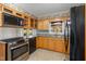 Updated kitchen with wood cabinets, granite counters and stainless steel appliances at 739 Silk Hope Lindley Mill Rd, Siler City, NC 27344