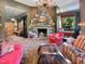 Relaxing living room with a stone fireplace and comfortable seating at 1153 Four Wheel Dr, Wake Forest, NC 27587