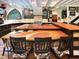 Open kitchen with large island, custom wood countertops, and dark cabinetry at 1153 Four Wheel Dr, Wake Forest, NC 27587