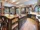 Gourmet kitchen features a large island with butcher block countertops and unique cabinetry at 1153 Four Wheel Dr, Wake Forest, NC 27587