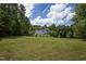 Exterior of charming two-story home with large backyard at 1153 Four Wheel Dr, Wake Forest, NC 27587