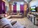 Living Room with sectional sofa, large TV, and rustic decor at 1153 Four Wheel Dr, Wake Forest, NC 27587