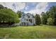 Exterior view of a charming two-story home with a large yard at 1153 Four Wheel Dr, Wake Forest, NC 27587
