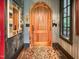 Unique entryway with a rustic wood door and chalkboard wall at 1153 Four Wheel Dr, Wake Forest, NC 27587