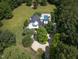 Aerial view of a home with a pool and circular driveway at 1153 Four Wheel Dr, Wake Forest, NC 27587