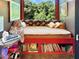Cozy built-in reading nook with window seat and bookshelves at 1153 Four Wheel Dr, Wake Forest, NC 27587