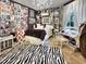 Bedroom with a collage wall and zebra patterned rug at 1153 Four Wheel Dr, Wake Forest, NC 27587