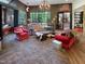Open living room with stone fireplace and large windows offering scenic views at 1153 Four Wheel Dr, Wake Forest, NC 27587