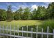 Large backyard with a fence and lush green lawn at 1153 Four Wheel Dr, Wake Forest, NC 27587