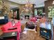 Spacious living room with a stone fireplace, comfortable seating, and large windows at 1153 Four Wheel Dr, Wake Forest, NC 27587