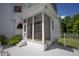 Cozy screened porch with seating area, offering shade and privacy at 1153 Four Wheel Dr, Wake Forest, NC 27587