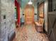 Rustic entryway with wood door, chalkboard wall, and decorative bench at 1153 Four Wheel Dr, Wake Forest, NC 27587
