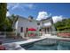 Inviting pool with patio furniture and a red umbrella at 1153 Four Wheel Dr, Wake Forest, NC 27587