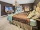 Spacious bedroom with large bed, unique chandelier, and artwork at 1153 Four Wheel Dr, Wake Forest, NC 27587