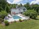 Luxury home with a pool, slide, and spacious backyard at 1153 Four Wheel Dr, Wake Forest, NC 27587