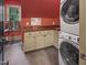 Laundry room with modern washer and dryer, and plenty of cabinet space at 1153 Four Wheel Dr, Wake Forest, NC 27587