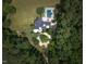 Aerial view of a home with a pool and circular driveway at 1153 Four Wheel Dr, Wake Forest, NC 27587