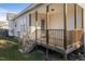 Wooden back porch with steps leading to the ground at 96 Abram Ct, Broadway, NC 27505