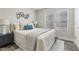 Bright bedroom with double bed, nightstand and window coverings at 96 Abram Ct, Broadway, NC 27505