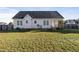 Rear view of house, showcasing a white exterior and lawn at 96 Abram Ct, Broadway, NC 27505