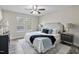 Spacious bedroom with a ceiling fan and large windows at 96 Abram Ct, Broadway, NC 27505