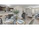 Open concept dining area with glass table and seating for four at 96 Abram Ct, Broadway, NC 27505