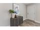 Entryway with console table, artwork, and hardwood floors at 96 Abram Ct, Broadway, NC 27505