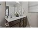 Double vanity bathroom with dark brown cabinets and a large mirror at 96 Abram Ct, Broadway, NC 27505