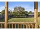 View of backyard from porch, featuring a large tree and grass at 96 Abram Ct, Broadway, NC 27505